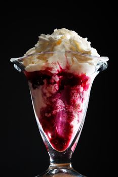 Ice cream in the glass on a black background