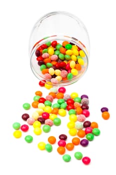 Candy in a glass jar on white background