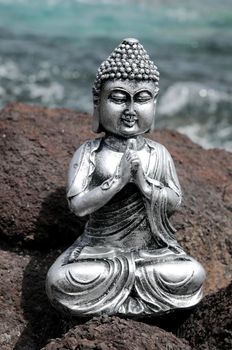 One Ancient Gray Buddha Statue Near The Ocean