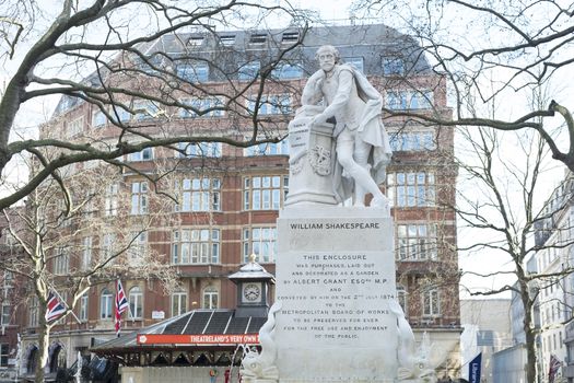 LONDON, UK - MARCH 14: Statue of William Shakespeare in water fountain in Leicester Square. March 01, 2014 in London.