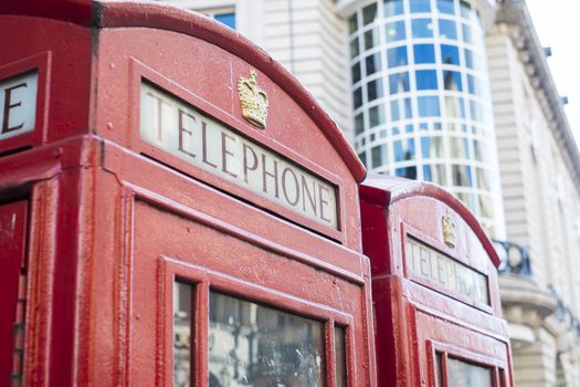 Detail of old red telephone booth in London, UK