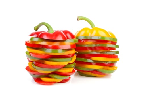 Two Paprika made out of colorful slices over white background