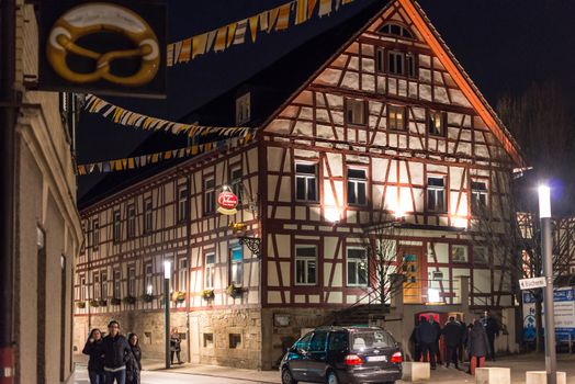 NEUHAUSEN, GERMANY ��� MARCH 4, 2014: The people of Neuhausen are about to celebrate the end of carnival (fasnet) season by burning a puppet that is wearing a traditional costume (called the ���H��s���) symbolizing carnival on March 4, 2014 in Neuhausen (near Stuttgart), Germany. Carnival has a very long tradition in Neuhausen with influences of the swabian alemanisch culture that can be seen by the wooden masks people are wearing as part of their costumes.