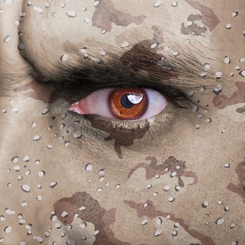 Desert army camouflage on angry soldier face