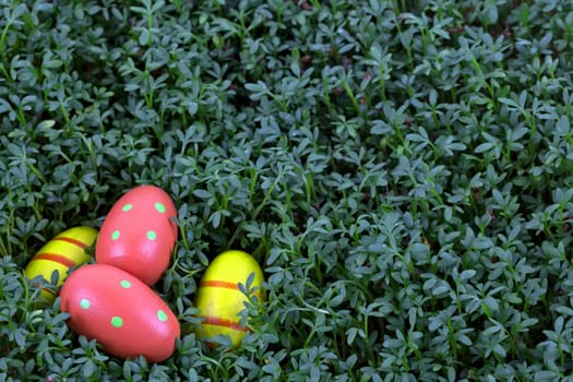 Colourful easter eggs on a green background