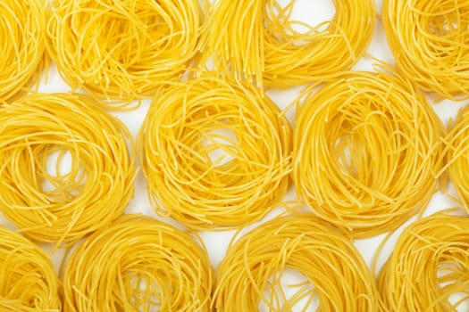 Yellow and beautiful pasta close-up as a background