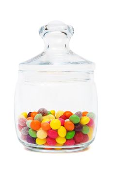 Candy in a glass jar on white background