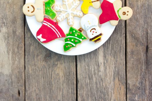 Gingerbread cookies on old wood background