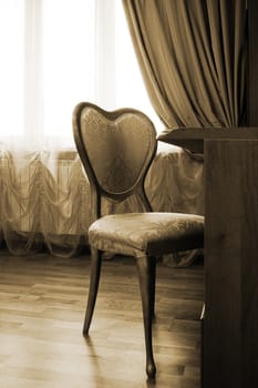 table and chair by the window in a modern apartment