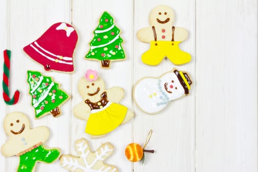 Cookies decorated with a Christmas theme on wood background