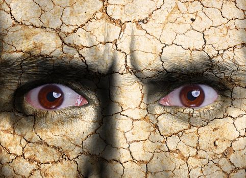 Beauty concept - face covered with cracked surface - symbol of dry skin