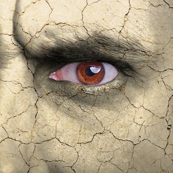 Beauty concept - face covered with cracked surface - symbol of dry skin