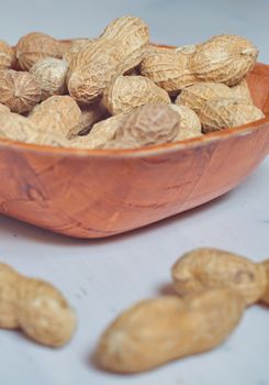Peanuts in a brown bowl