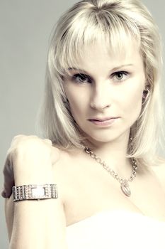 studio portrait of beautiful woman with white dress and accessories