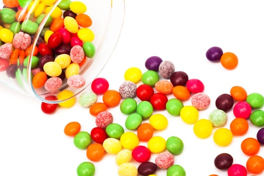 Candy in a glass jar on white background