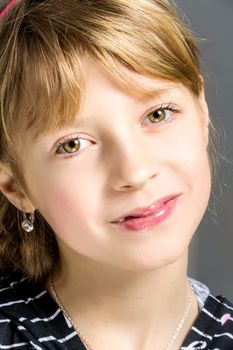 Studio portrait of young beautiful girl with nice eyes on black