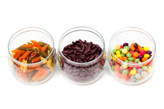 Food in glass jars on a white background