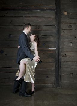 man and a woman dancing against the boards