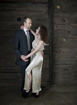 man and a woman dancing against the boards