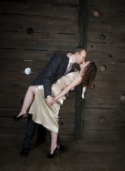 man and a woman dancing against the boards