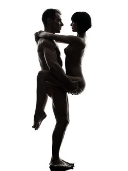 one caucasian couple man woman sexual kamasutra posture love activity in silhouette studio on white background