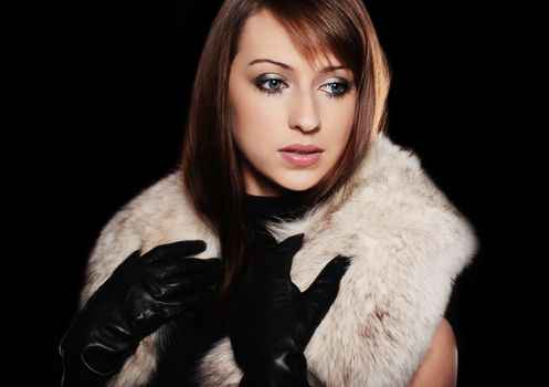 Beautiful caucasian brunette over black background
