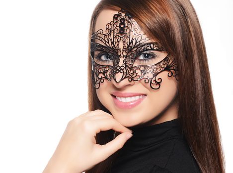 Beautiful woman in carnival mask over white background