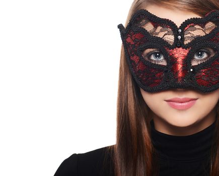 Beautiful woman in carnival mask over white background