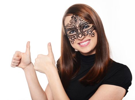 Beautiful woman in carnival mask over white background