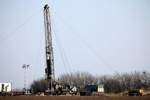 oil drilling rig and equipment on field