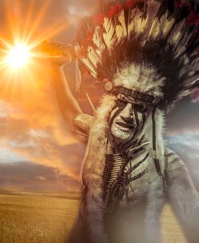 American Indian warrior, chief of the tribe. man with feather headdress and tomahawk