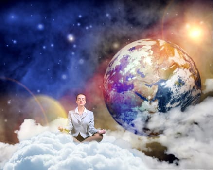 image of a businesswoman meditating in the clouds in space