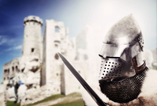 Portrait of XV century knight over castle background