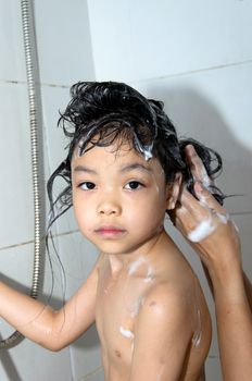 Asian girls are wash your hair in the bathroom.