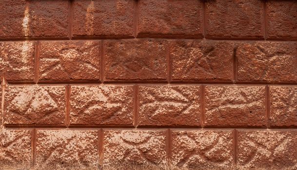 Fragment of old decorative finishes on the wall of an apartment house