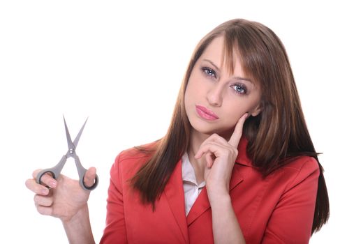 Pretty woman with scisors posing over white background