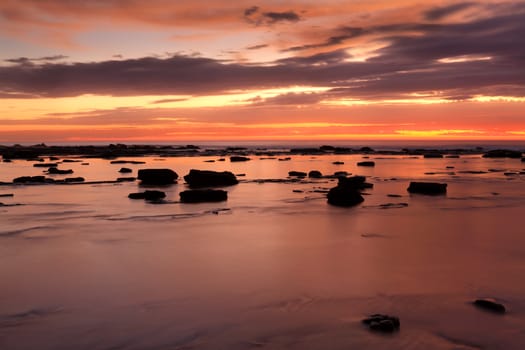 For a brief few minutes the pre sunrise sky was full of fiery colours.  Bateau Bay rock shelf at high tide