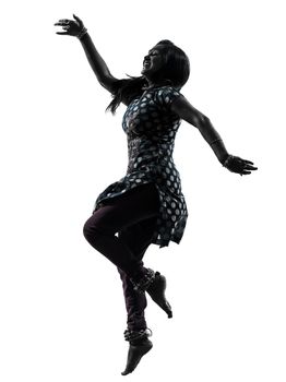 one indian woman dancer dancing in silhouette studio isolated on white background