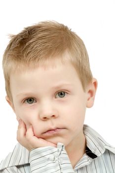 Studio portrait of young pensive beautiful boy on white background