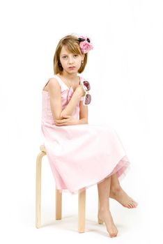 Studio portrait of young beautiful girl with sun eyeglasses on white background