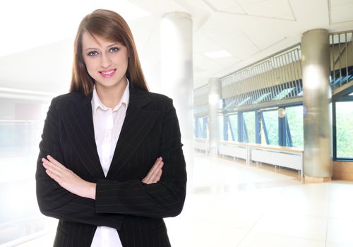 Pretty businesswoman in office building