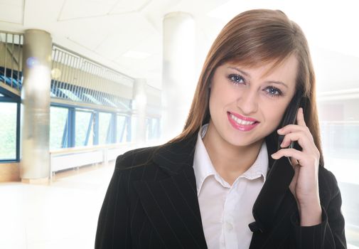 Pretty businesswoman in office building