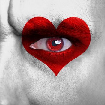 Love background - human face with red heart on eye