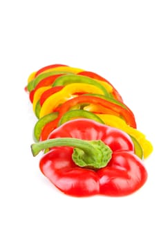 Paprika made out of colorful slices over white background