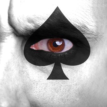 Cards symbol painted on human face - symbol of hazard