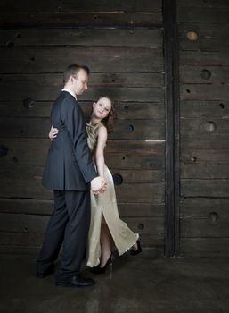 man and a woman dancing against the boards