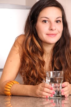 A young woman drinking some water.