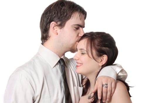Cute young couple with man kissing woman's forehead,  together on a white background