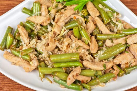 Tasty green beans with chicken meat