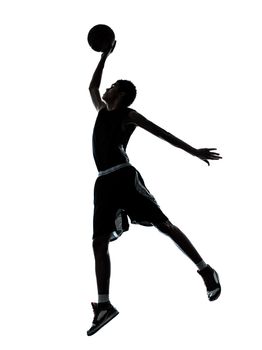 one young man basketball player dunking silhouette in studio isolated on white background